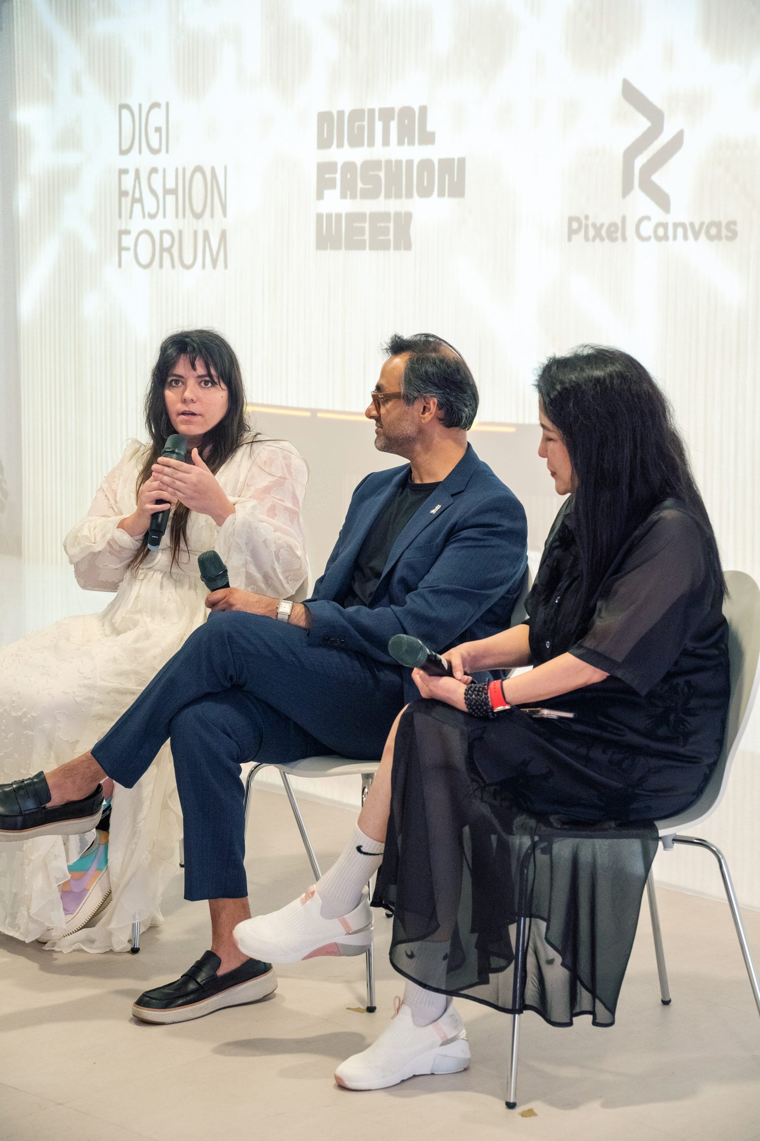 Elena Dimopoulou speaking on a panel with two fellow panelists at Digital Fashion Week x DigiFashion Forum, Taipei